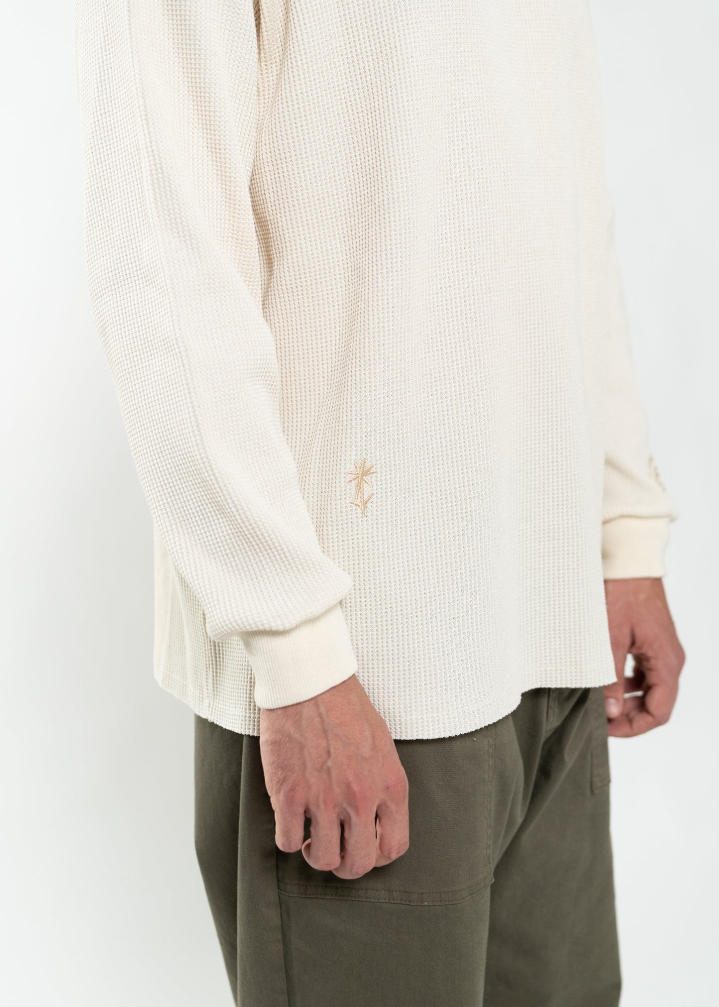 Flowers for Society waffle longsleeve off white side view worn by model Ben standing