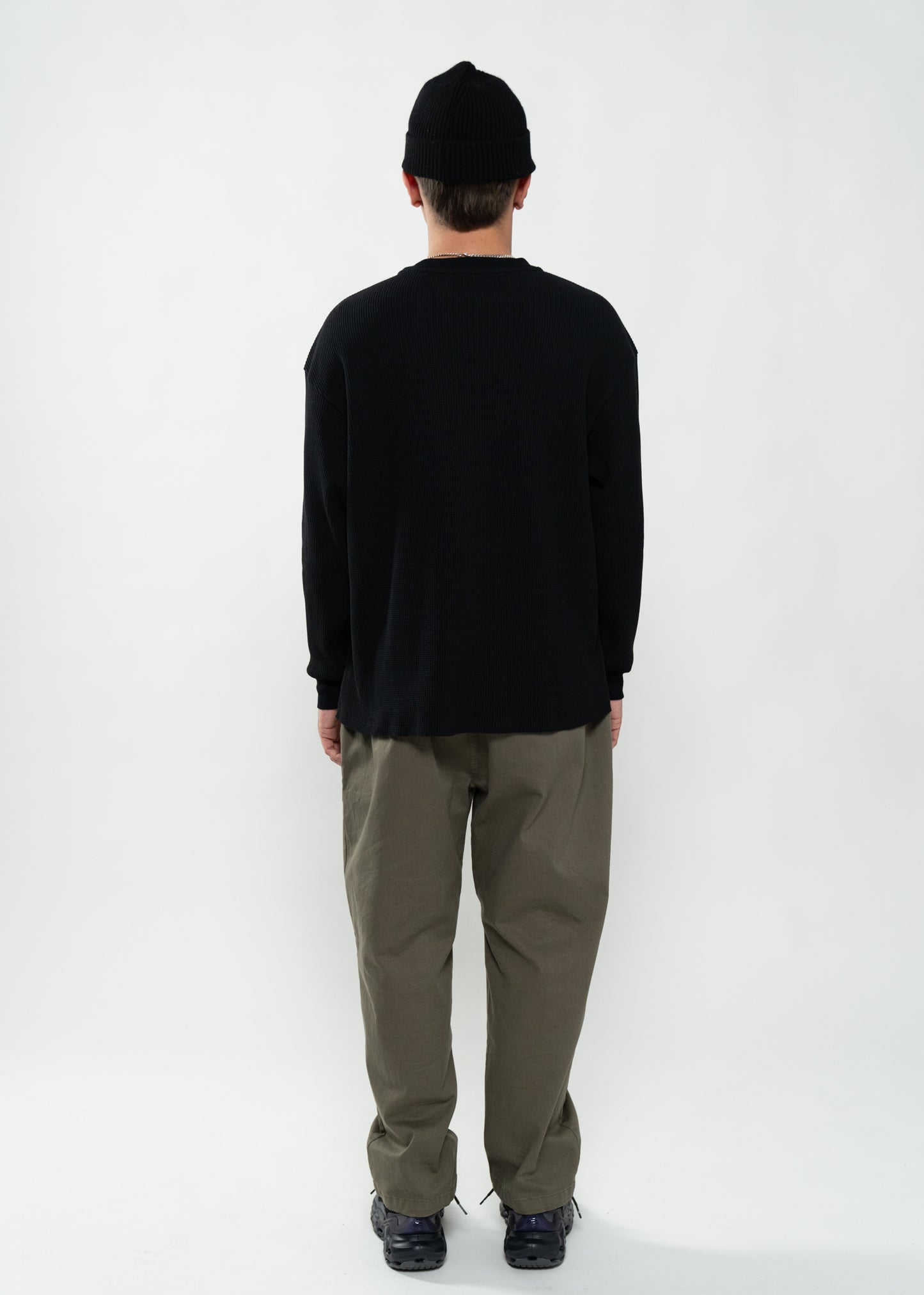 Flowers for Society waffle longsleeve black back view worn by model Ben standing