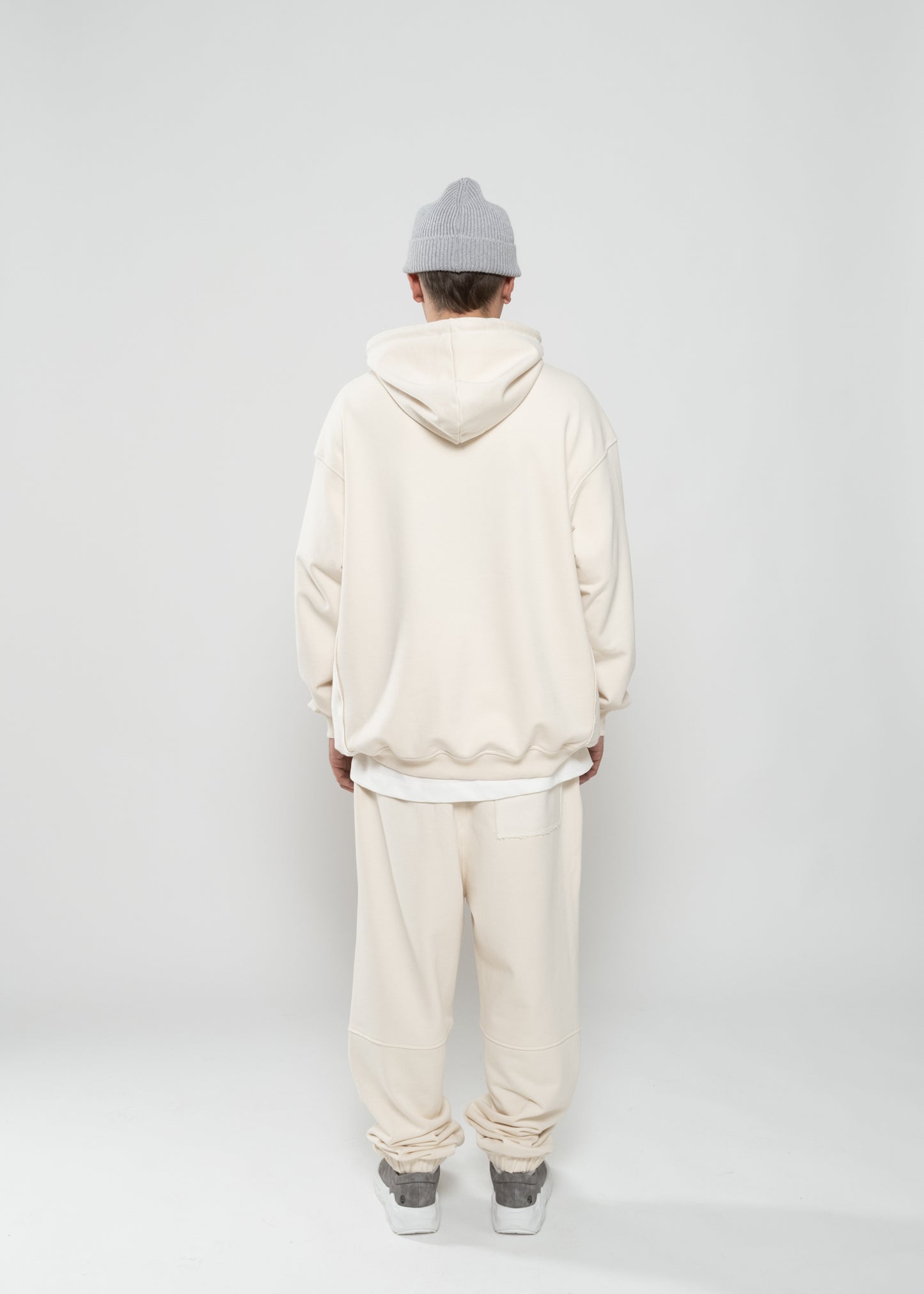 Flowers for Society basic hoodie off white back view worn by model Ben