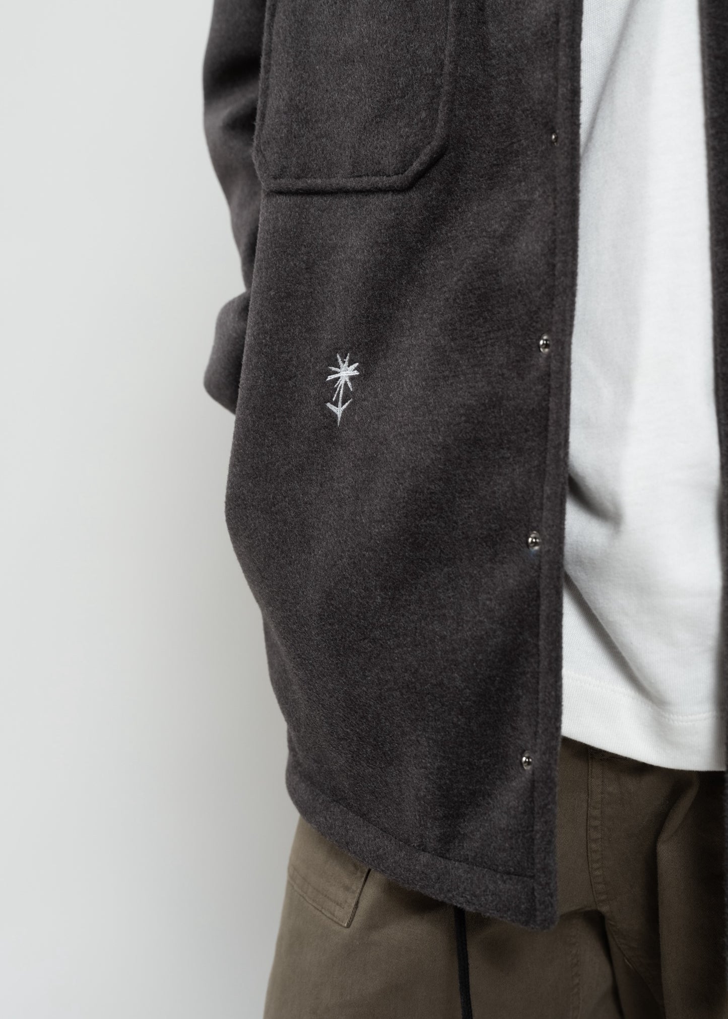 Flowers for Society jacket anthra front view detailed shot flower radicle logo worn by model Ben
