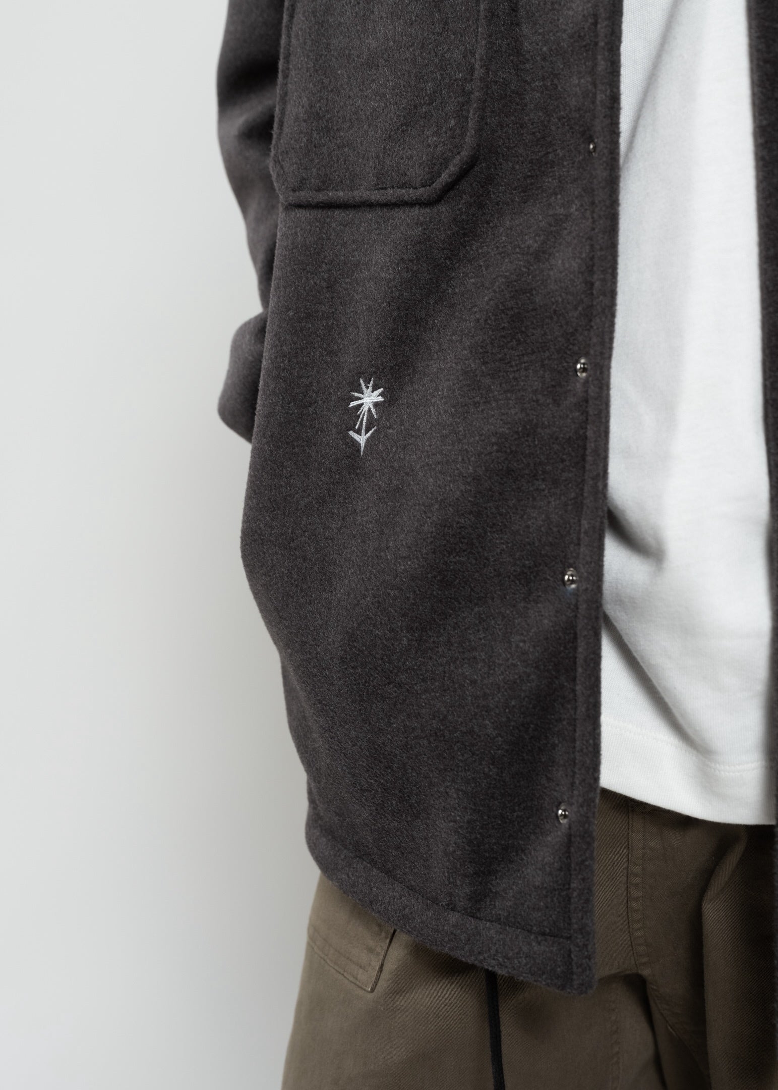 Flowers for Society jacket anthra front view detailed shot flower radicle logo worn by model Ben