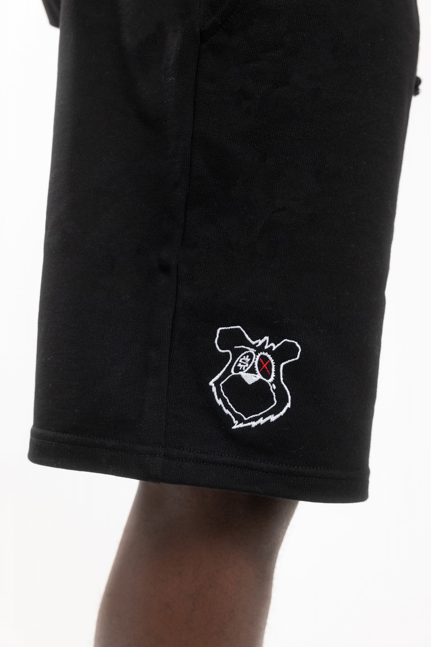 Flowers for Society King Saladeen shorts collaboration King Saladeen black medial view worn by model standing
