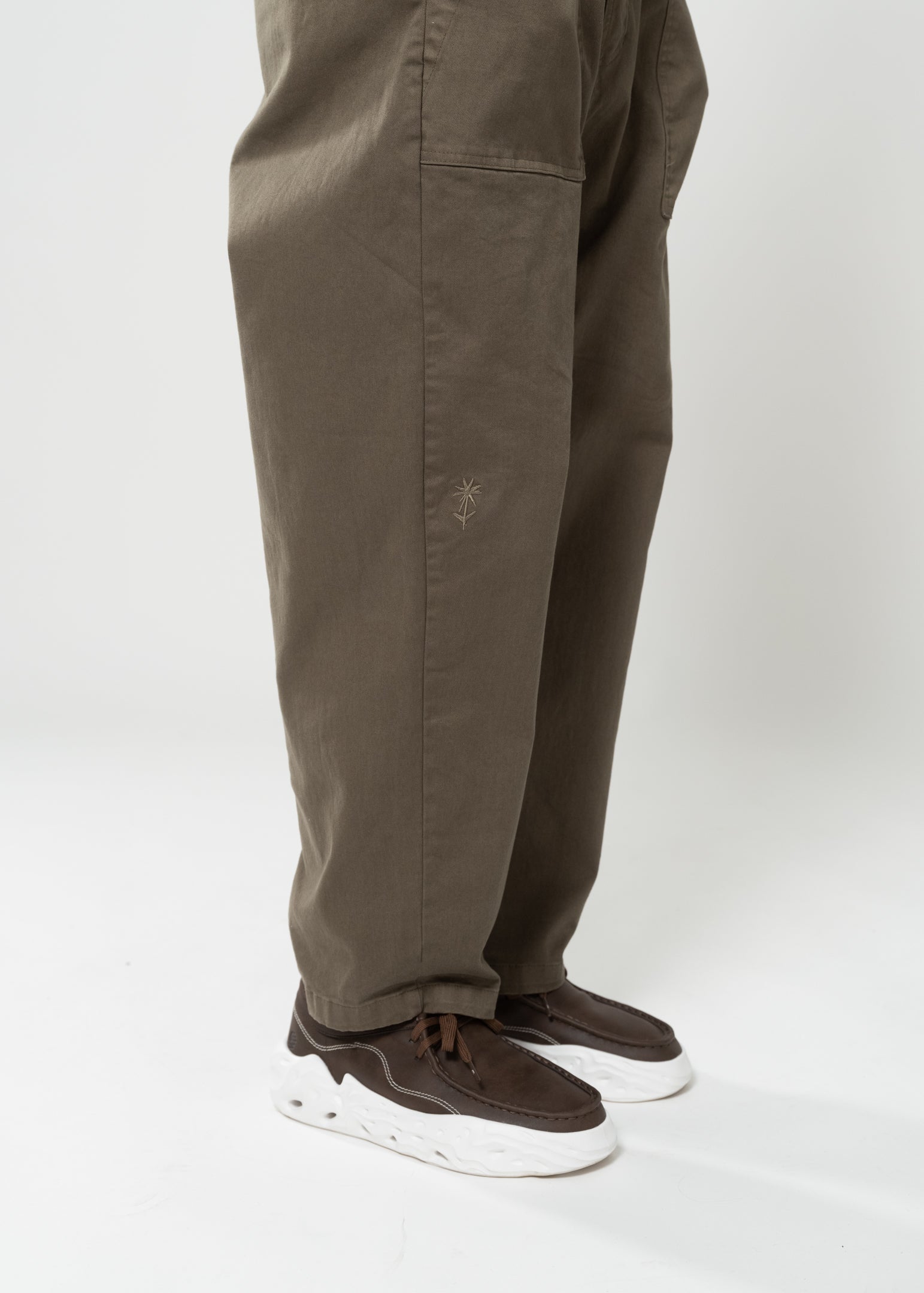 Flowers for Society chino pant olive sideview worn by model standing