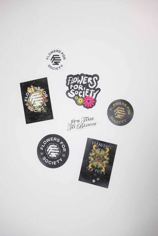 Flowers for Society logo sticker pack multicolor topview laying on white background 