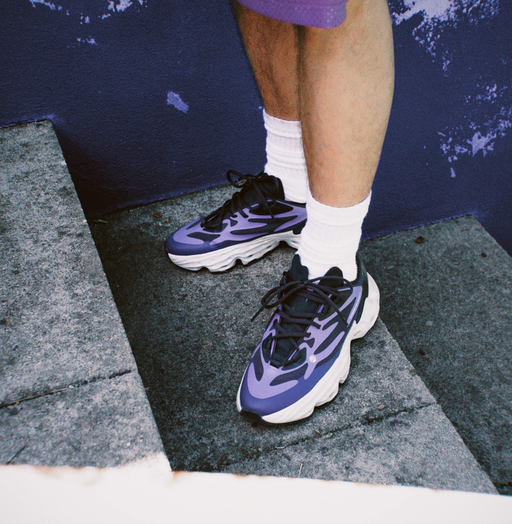 Flowers for Society Sneaker Seed.One Orient purple black sideview worn by model Ben standing