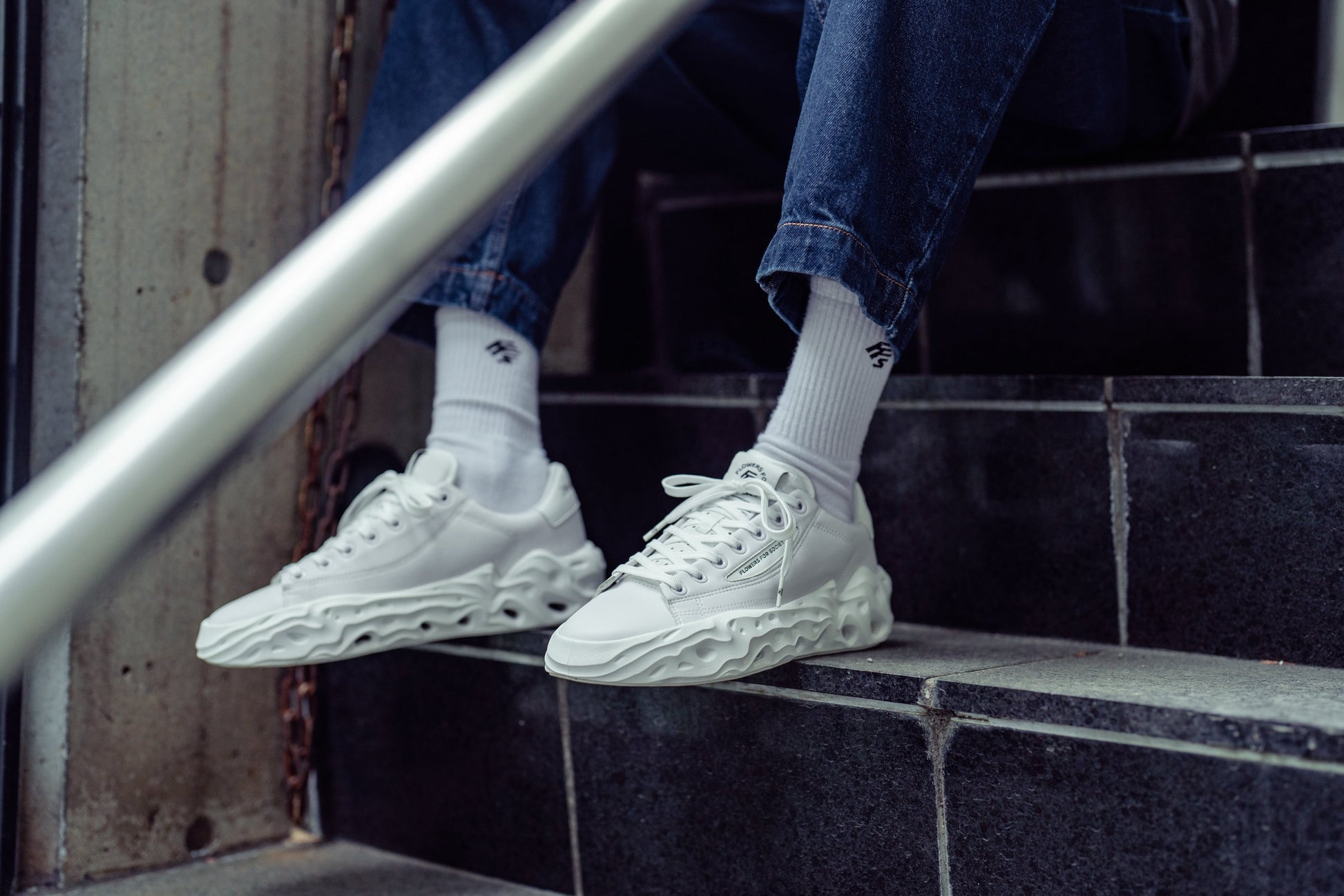 Flowers For Society Sneaker Radicle Topless white sideview worn by model sitting on stairs